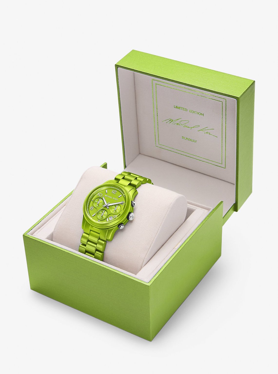 Michael Kors MK7480LE open box view – green-tone chronograph watch displayed in official packaging with hand – luxury presentation by HEY WATCH.