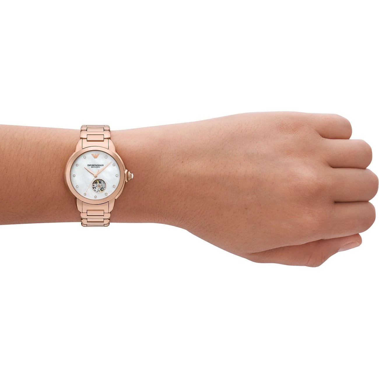 Emporio Armani AR60072 worn on wrist – white mother-of-pearl dial and rose gold-tone stainless steel bracelet offering a versatile and stylish look – timeless women’s watch presented by HEY WATCH.