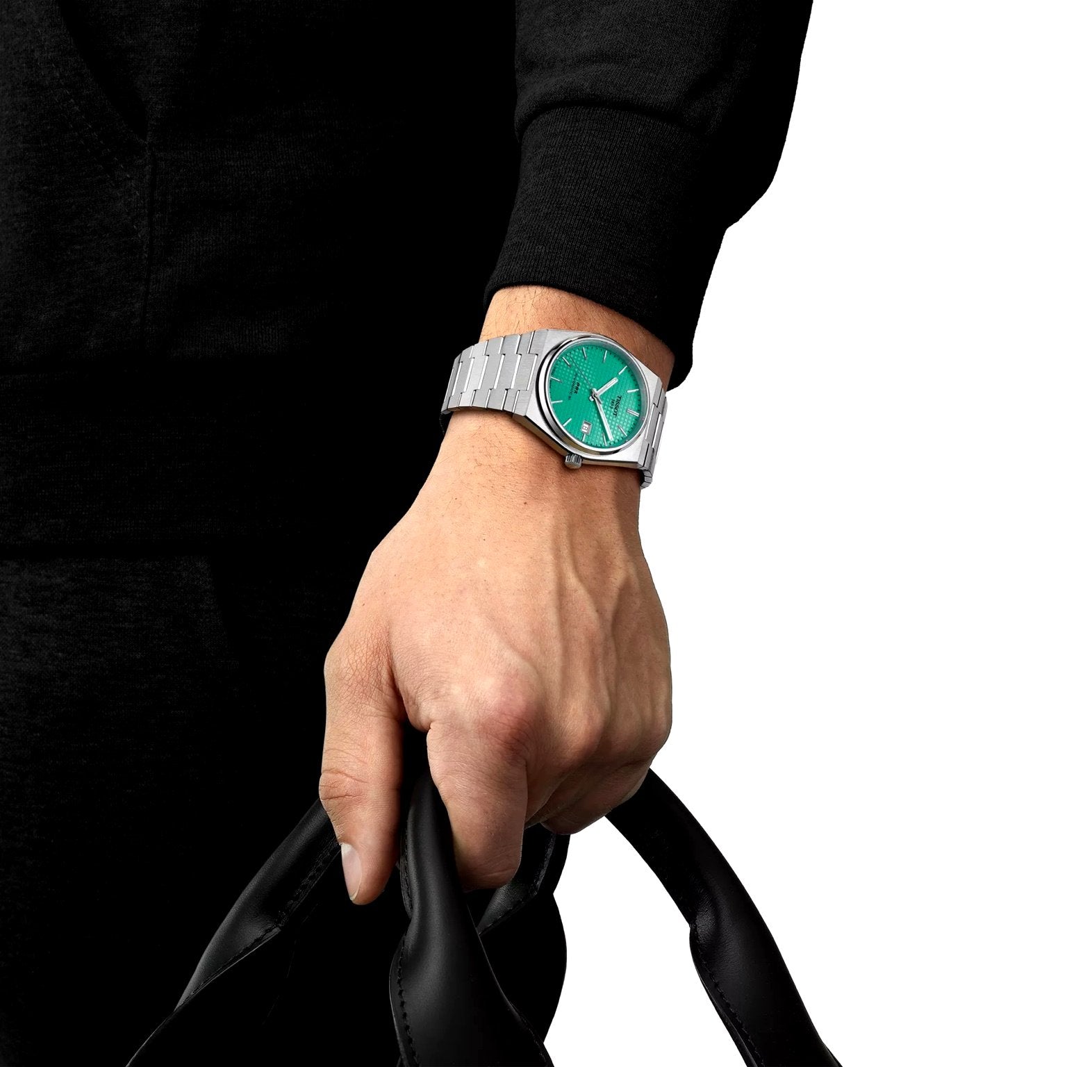 Tissot PRX Powermatic 80 on wrist – 40mm stainless steel watch with mint green dial worn with elegance – stylish Swiss automatic watch by HEY WATCH.