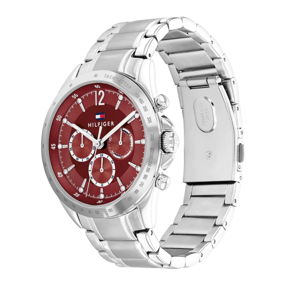Tommy Hilfiger 1782559 angled view – sporty women’s watch with sunray red dial, silver case and bracelet – bold fashion piece by HEY WATCH.