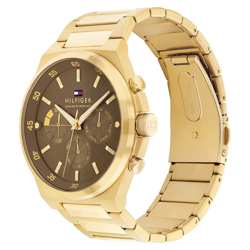 Tommy Hilfiger 1792090 side view – gold stainless steel case with pushers and sleek brown dial – modern men’s watch by HEY WATCH.